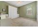 Light and airy bedroom with built-in white storage cabinets, a desk and a ceiling fan at 10030 Chatham Oaks Ct, Orlando, FL 32836