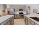 Well-equipped kitchen with stainless steel appliances, a tiled backsplash, and sleek countertops at 10030 Chatham Oaks Ct, Orlando, FL 32836