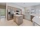 Bright and airy kitchen featuring stainless steel appliances, an island, and plenty of counter space at 10030 Chatham Oaks Ct, Orlando, FL 32836
