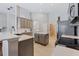 Modern kitchen with stainless steel appliances, a center island, and ample cabinet space at 10030 Chatham Oaks Ct, Orlando, FL 32836
