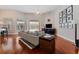 Inviting living room with hardwood floors, neutral decor, and a view of the pool area at 10030 Chatham Oaks Ct, Orlando, FL 32836