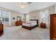 Spacious main bedroom with carpeted floors, natural light, and ample closet space at 10030 Chatham Oaks Ct, Orlando, FL 32836