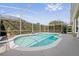 Screened-in pool with a garden at 10030 Chatham Oaks Ct, Orlando, FL 32836