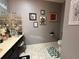 Stylish bathroom featuring vanity sinks, framed mirrors, and tile floors at 10075 Sw 91St Pl, Ocala, FL 34481