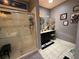 Bathroom with a glass shower, vanity with makeup area, and stylish decor at 10075 Sw 91St Pl, Ocala, FL 34481