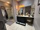 Modern bathroom featuring a glass shower, vanity with makeup area, and stylish decorations at 10075 Sw 91St Pl, Ocala, FL 34481