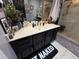 Bathroom vanity with a mirror, lighting, and a shower with glass doors at 10075 Sw 91St Pl, Ocala, FL 34481