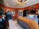 Spacious bedroom featuring colorful walls, a comfortable bed, and lots of decor at 10075 Sw 91St Pl, Ocala, FL 34481