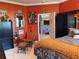 Brightly colored bedroom with unique decor, tile flooring, and a comfortable bed at 10075 Sw 91St Pl, Ocala, FL 34481