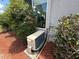 Exterior AC unit with landscaping and partially viewed window at 10075 Sw 91St Pl, Ocala, FL 34481