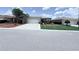 Charming single-story home featuring a well-maintained front yard and a two-car garage at 10075 Sw 91St Pl, Ocala, FL 34481