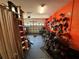 Organized garage displaying motorcycle parking, storage, and wall-mounted helmet racks at 10075 Sw 91St Pl, Ocala, FL 34481