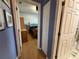 A hallway view showing the bathroom and bedroom at 10075 Sw 91St Pl, Ocala, FL 34481