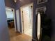 A hallway view showing the bathroom and bedroom at 10075 Sw 91St Pl, Ocala, FL 34481
