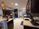 Spacious kitchen features tile floors, stainless steel appliances, and dark wood cabinetry at 10075 Sw 91St Pl, Ocala, FL 34481