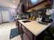 Modern kitchen showcasing stainless steel appliances, tiled backsplash, and ample counter space at 10075 Sw 91St Pl, Ocala, FL 34481