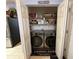 Convenient laundry room with modern washer and dryer, plus plenty of storage space at 10075 Sw 91St Pl, Ocala, FL 34481