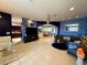 Large living room featuring tile floors and access to kitchen and dining areas at 10075 Sw 91St Pl, Ocala, FL 34481