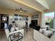 Cozy living room featuring comfortable seating, a TV, ceiling fans, and stylish decor at 10075 Sw 91St Pl, Ocala, FL 34481