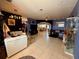 Living room with tile floors, open layout, and views of multiple rooms at 10075 Sw 91St Pl, Ocala, FL 34481