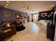 Living room with tile flooring, varied decor, and open layout at 10075 Sw 91St Pl, Ocala, FL 34481