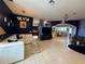 Spacious living room with tile floors and an open layout to the dining area at 10075 Sw 91St Pl, Ocala, FL 34481