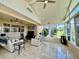 This sunroom features tile floors, lots of light, and comfortable seating for friends and Gathering at 10075 Sw 91St Pl, Ocala, FL 34481