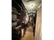 Organized walk-in closet with custom shelving, hanging rods, and ample storage for clothes and accessories at 10075 Sw 91St Pl, Ocala, FL 34481