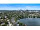 Scenic aerial of a neighborhood with lakefront property showcasing beautiful homes and lush surroundings at 1010 Terrace Blvd, Orlando, FL 32803