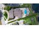 Aerial view of a luxury home with a swimming pool, fire pit, and manicured landscaping near the water at 1010 Terrace Blvd, Orlando, FL 32803