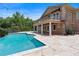 Luxury backyard with a stunning pool, covered patio, and manicured landscaping creates an ideal outdoor retreat at 1010 Terrace Blvd, Orlando, FL 32803