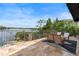 Outdoor patio with peaceful lake view, comfortable seating, and wrought iron railing at 1010 Terrace Blvd, Orlando, FL 32803
