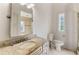 Bathroom featuring vanity with stone counters, tile floors, and a tiled shower at 1010 Terrace Blvd, Orlando, FL 32803