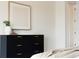 Close-up of the bedroom dresser featuring elegant decorations and artwork at 1010 Terrace Blvd, Orlando, FL 32803