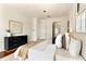 Bright bedroom featuring a plush bed, stylish dresser, and neutral decor at 1010 Terrace Blvd, Orlando, FL 32803