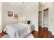 Cozy bedroom with white walls, minimalist decor and a neatly arranged closet space at 1010 Terrace Blvd, Orlando, FL 32803