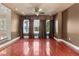 The dining room features rich hardwood flooring, elegant window treatments, and recessed lighting for a cozy ambiance at 1010 Terrace Blvd, Orlando, FL 32803