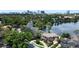 Stunning two-story home with lush landscaping and a picturesque lake view, showcasing elegant architecture at 1010 Terrace Blvd, Orlando, FL 32803