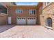 Spacious three-car garage with a brick driveway, offering ample parking and curb appeal to the property at 1010 Terrace Blvd, Orlando, FL 32803