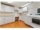 Functional laundry room featuring modern washer and dryer, ample white cabinetry, and a practical layout at 1010 Terrace Blvd, Orlando, FL 32803
