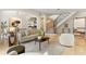 Bright and airy living room showcasing a curved staircase, modern decor, and elegant finishes at 1010 Terrace Blvd, Orlando, FL 32803