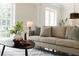 Bright living room featuring neutral furniture, stylish accents, and large windows for natural light at 1010 Terrace Blvd, Orlando, FL 32803