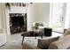 Cozy living room features a marble fireplace, neutral furnishings, and ample natural light from nearby windows at 1010 Terrace Blvd, Orlando, FL 32803
