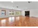 Bright living area with tiled flooring, large windows overlooking the pool and backyard, and access to other rooms at 1010 Terrace Blvd, Orlando, FL 32803