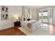 Elegant bedroom with hardwood floors, lake view balcony, and stylish black and white decor at 1010 Terrace Blvd, Orlando, FL 32803
