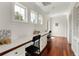 Bright home office area with hardwood floors, built-in desks and drawers, and natural light at 1010 Terrace Blvd, Orlando, FL 32803