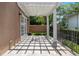 Charming outdoor patio featuring a pergola, stone flooring, and privacy fence, creating an inviting space for outdoor living at 1010 Terrace Blvd, Orlando, FL 32803