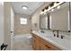 Bathroom featuring a new vanity with double sinks and modern countertops at 10545 Parkway Dr, Clermont, FL 34711