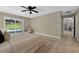 Bedroom featuring tile floors, access to pool area, and a ceiling fan at 10545 Parkway Dr, Clermont, FL 34711