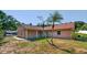Well maintained single-story brick home featuring a tidy yard, updated landscaping and mature trees at 10545 Parkway Dr, Clermont, FL 34711